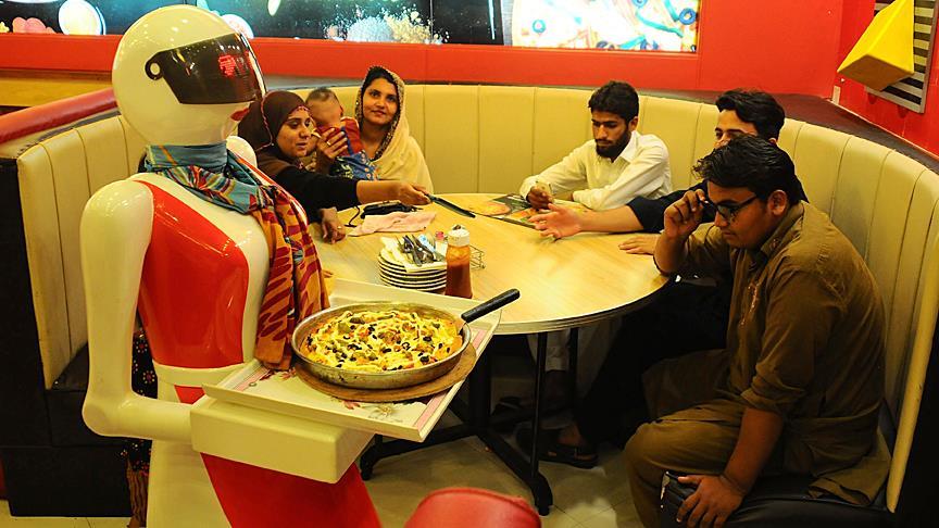 Robot waiters serve at Pakistan restaurant
